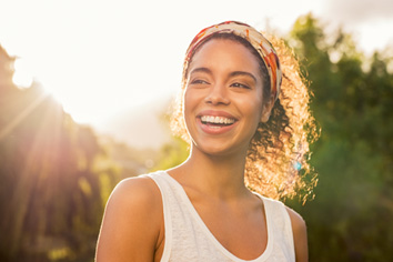 Woman smiling while walking outside