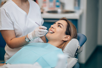 a patient during her routine dental checkup