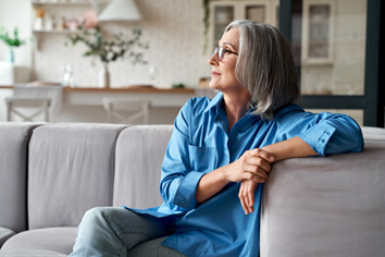 a woman relaxing on her couch